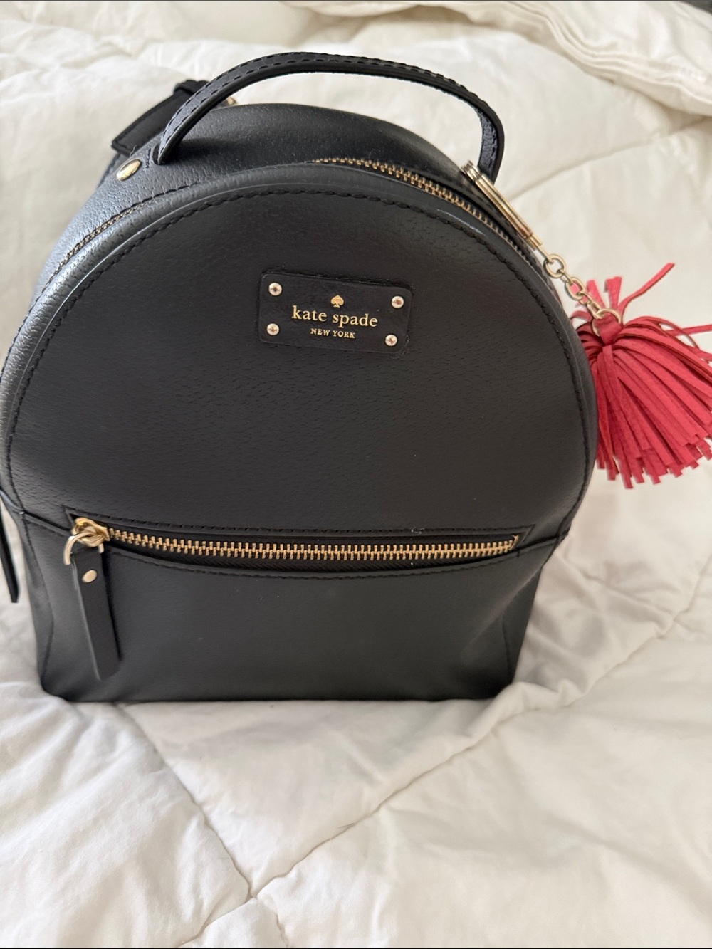 kate spade Black Leather Mini Backpack with Pink Tassel Charm